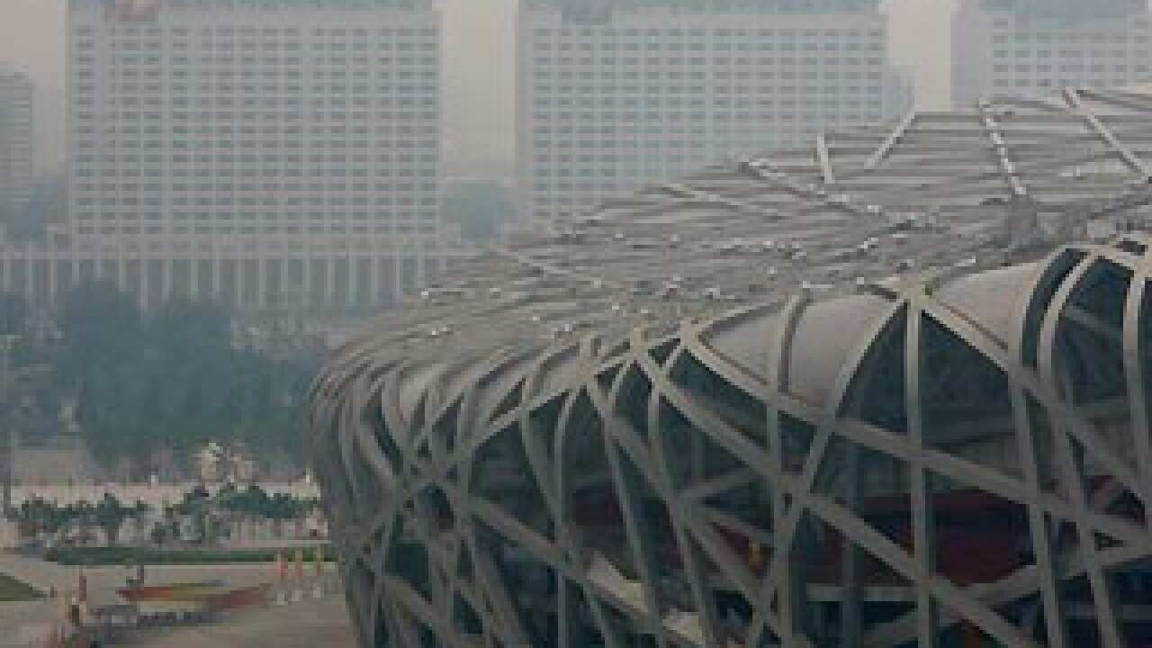 Smog surrounds the Bird's Nest stadium in Beijing