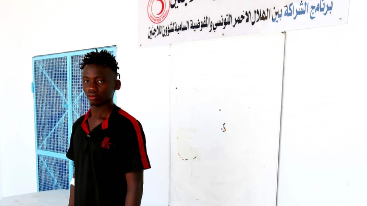 A Malian survivor of a shipwreck stands in the Red Crescent centre of Zarzis, southern Tunisia