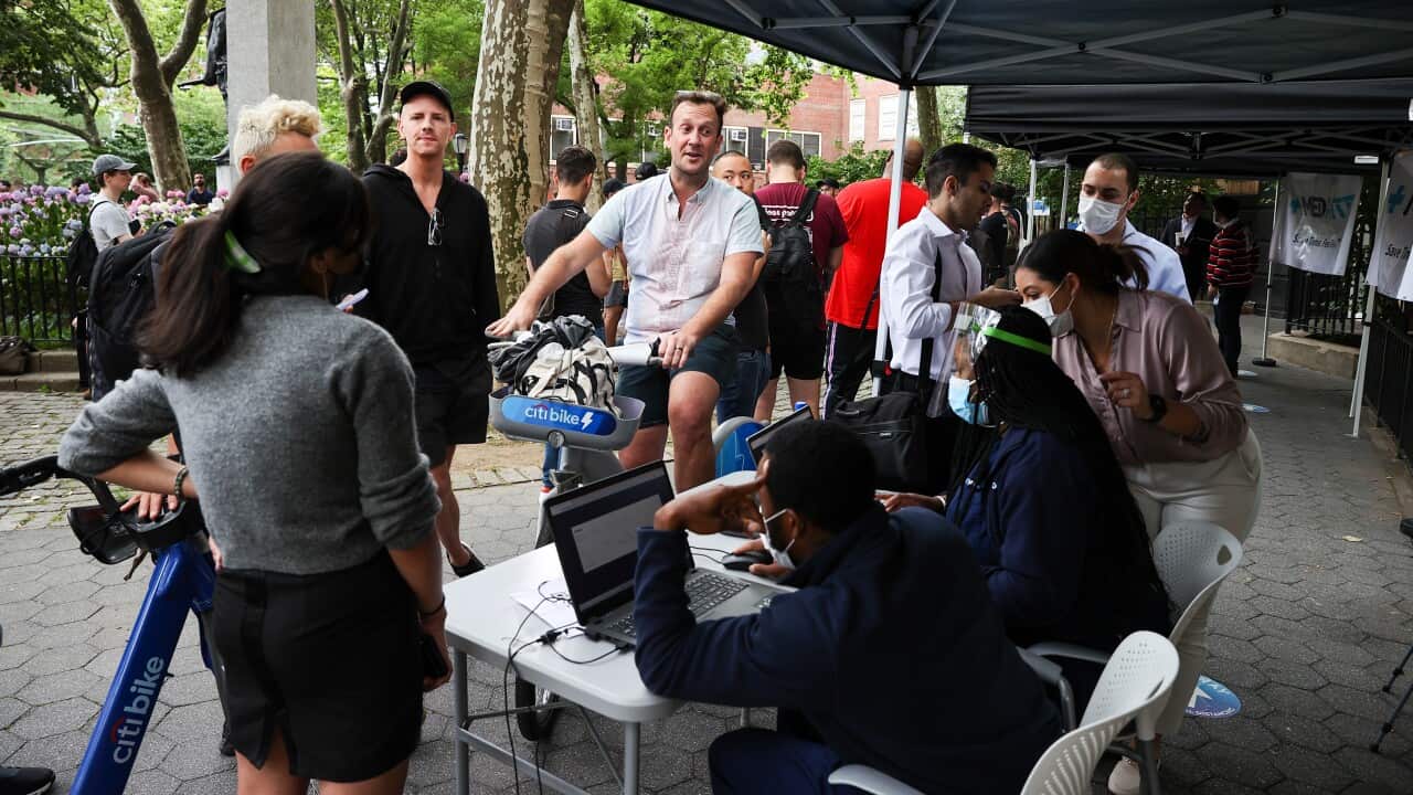 People queue up to get vaccinated.