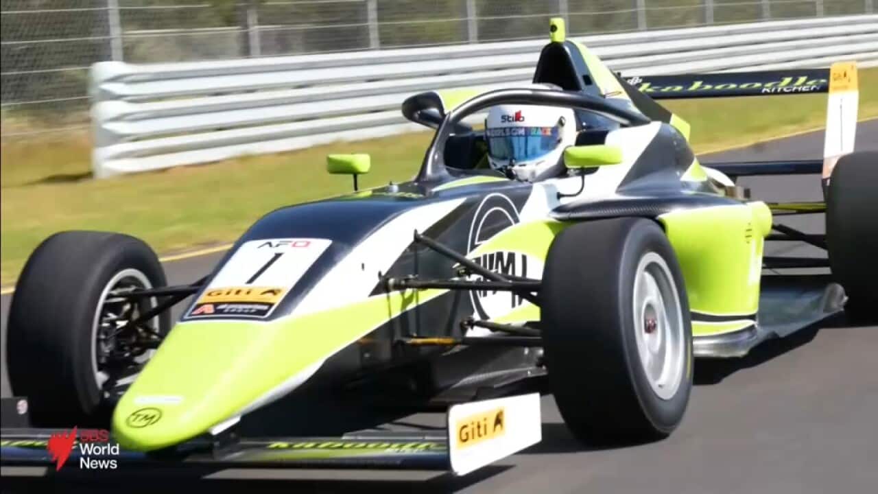 Journalist reports on a young female Formula One player hoping to change the game