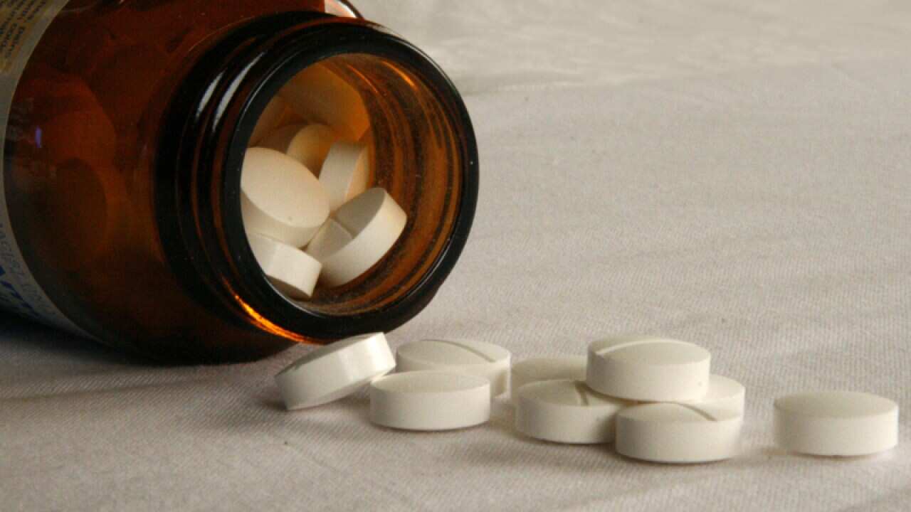 Tablets fall from a jar