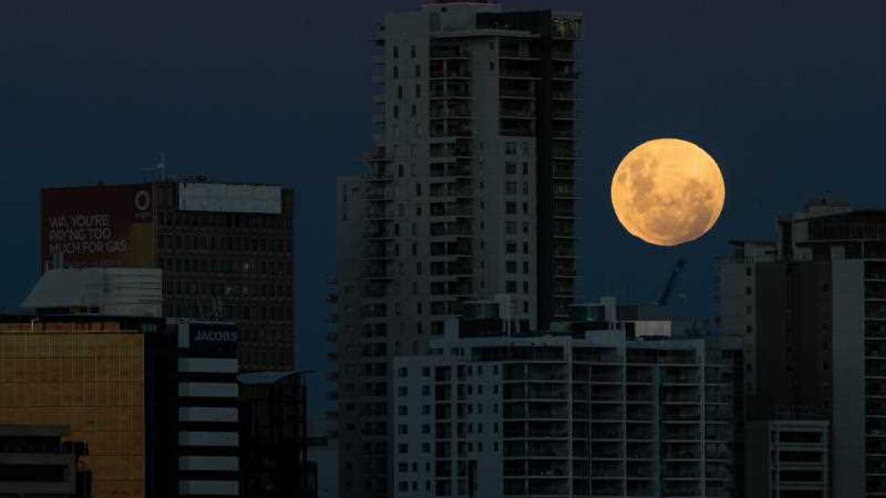 A super blue blood moon rises over the city of Perth in Western Australia on Thursday, January 31, 2018.