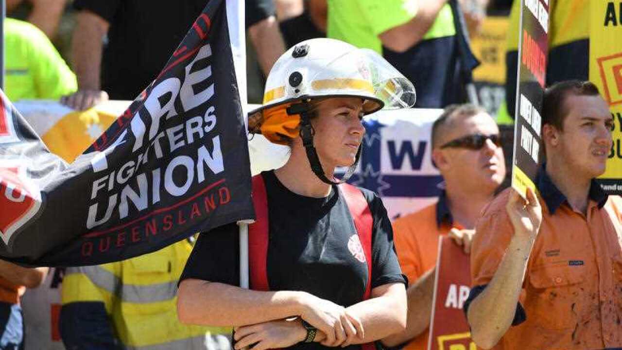 Workers are seen during a union protest against the slashing of penalty rates and the Federal Government's tough new building code in Brisbane