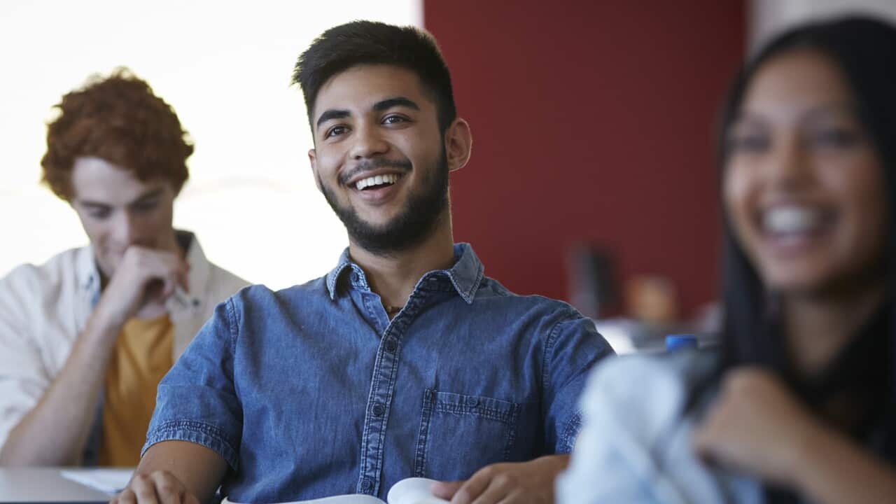 Students laughing in classroom