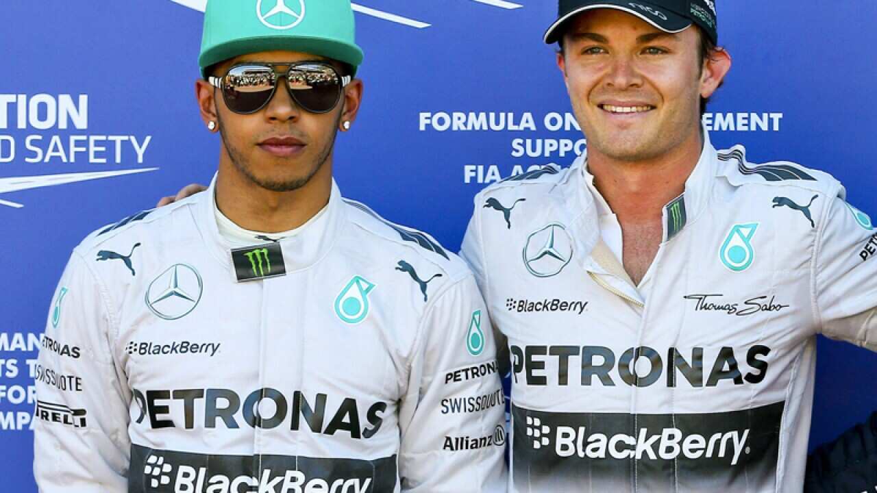 Mercedes Formula One drivers Lewis Hamilton (L) and Nico Rosberg