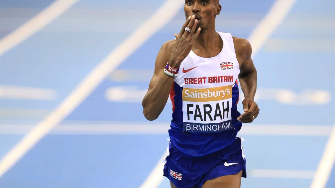 Mo Farah celebrates crossing the line in the men's 2 mile race in a new world record during the Sainsbury's Indoor Grand Prix.