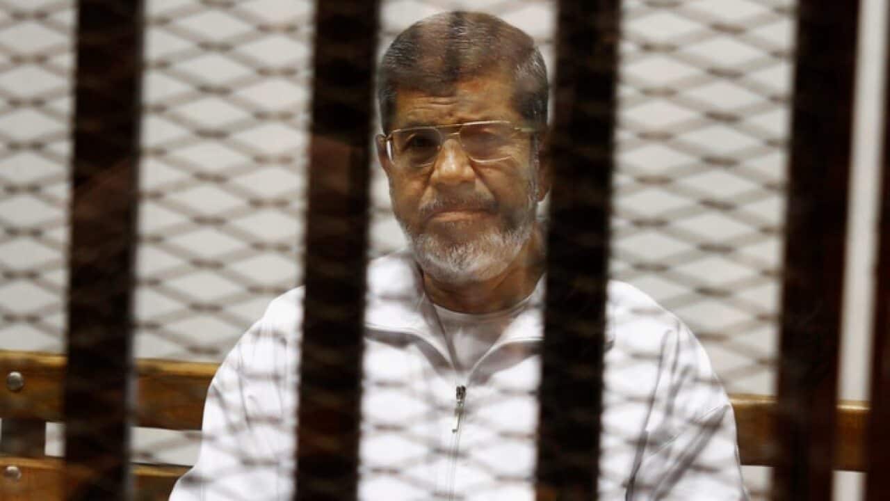 File photo of Egypt's ousted Islamist President Mohammed Morsi in the Police Academy courthouse in Cairo