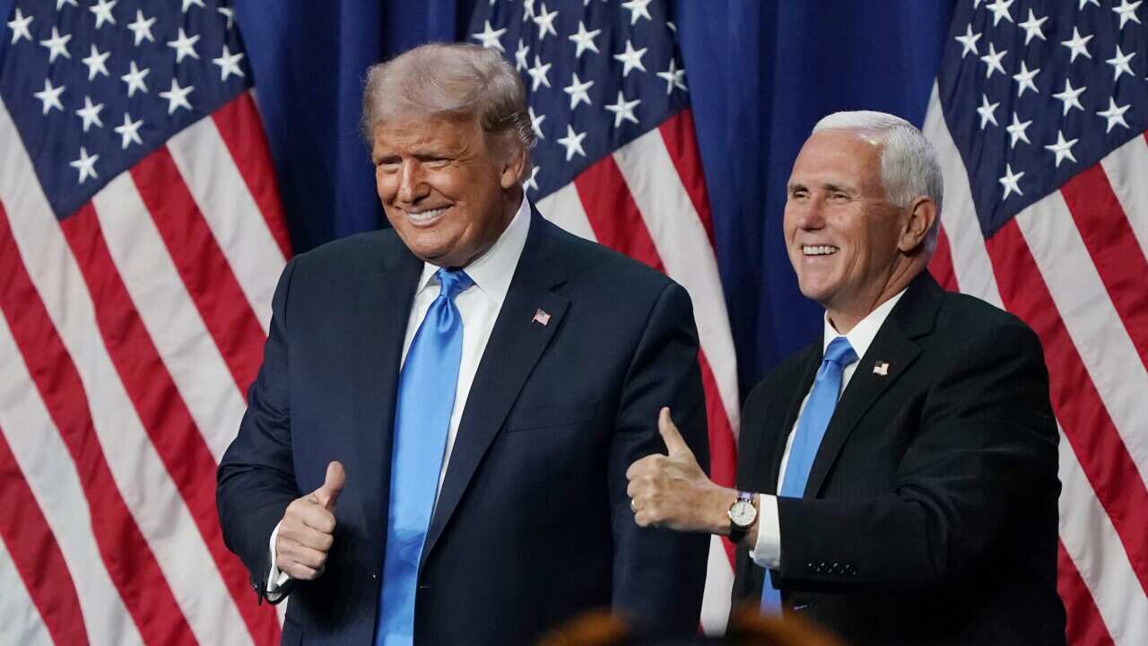 President Donald Trump and Vice President Mike Pence give a thumbs up after speaking on the first day of the RNC in Charlotte, North Carolina.