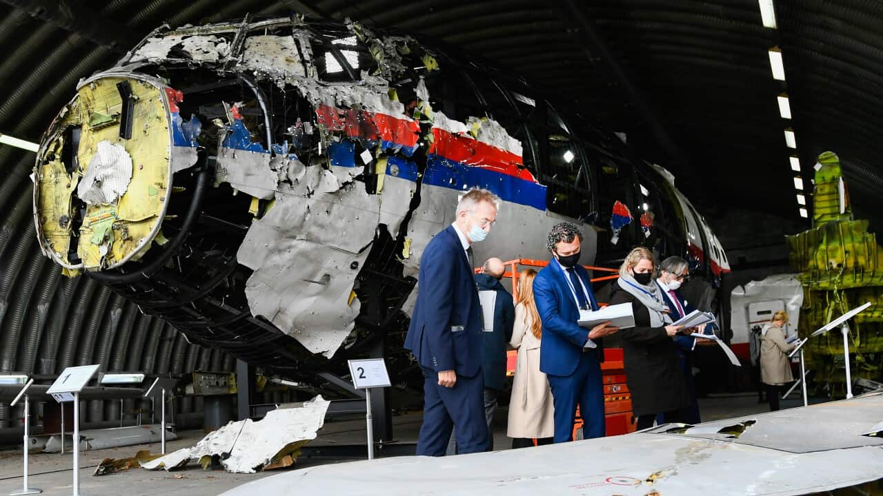 Lawyers attend the judges' inspection of the reconstruction of the MH17 wreckage, as part of the murder trial ahead of the beginning of a critical stage, on May 26, 2021 in Reijen, Netherlands.