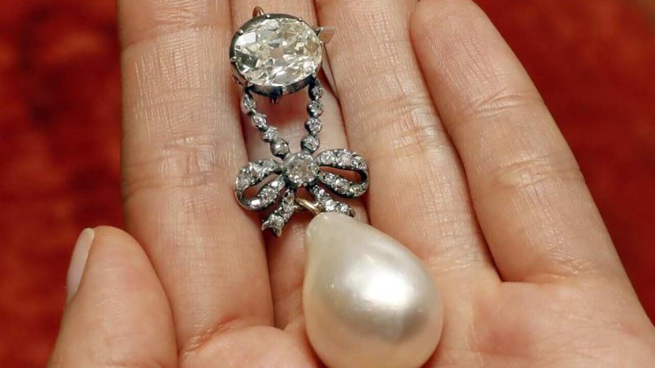 The Queen Marie Antoinette Pearl and diamond pendant have sold for $US32 million.