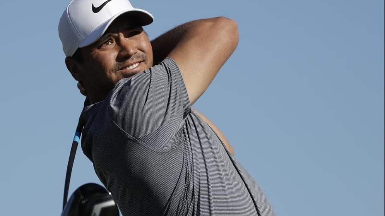 Jason Day, of Australia, watches his tee shot