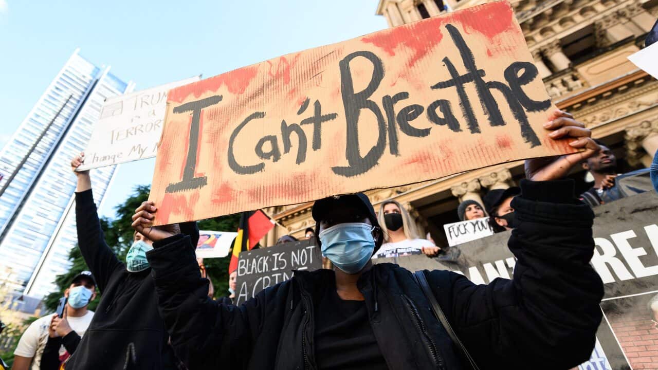 Protesters participate in a Black Lives Matter rally in Sydney, Saturday, June 6, 2020. The rally was ruled illegal by the NSW Supreme Court yesterday, but the ruling was overturned this afternoon. (AAP Image/James Gourley) NO ARCHIVING