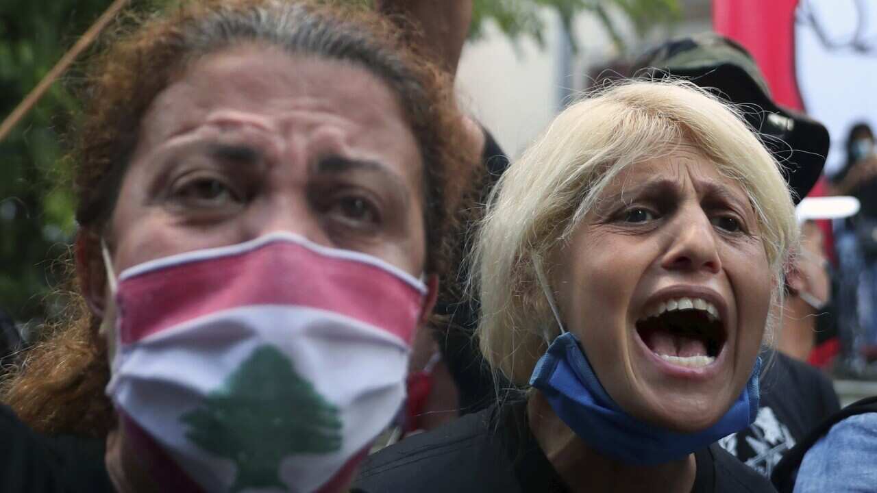 Anti-government protesters chant slogans inside the Lebanese foreign ministry in Beirut, Lebanon.