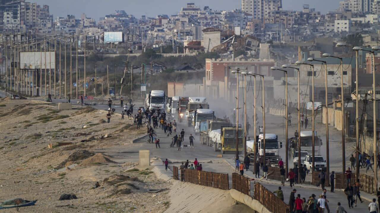 Palestinians storm trucks loaded with humanitarian aid brought in through a new US-built pier (AAP)