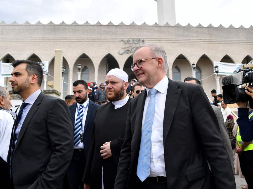 A group of men wearing suits seen outside a mosque in Sydney