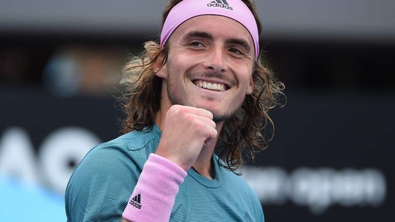 Stefanos Tsitsipas gestures.