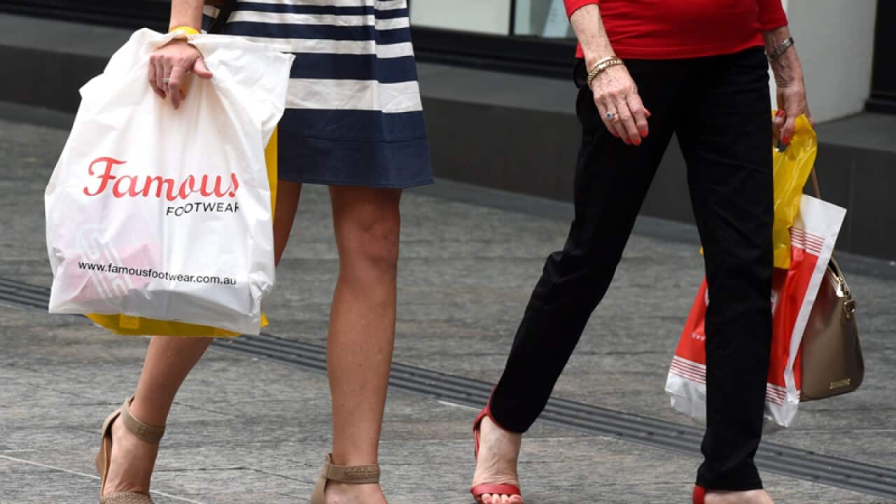 Shoppers walk through Queen Street Mall in Brisbane