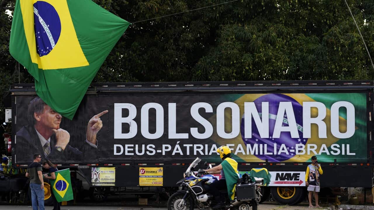 A truck bearing the image of Brazilian President Jair Bolsonaro and the Portuguese words "Bolsonaro, God, Fatherland, Family, Brazil", is parked at a camp set up by Bolsonaro supporters in Brasilia, Brazil, Monday, Sept. 6, 2021. People are arriving to th
