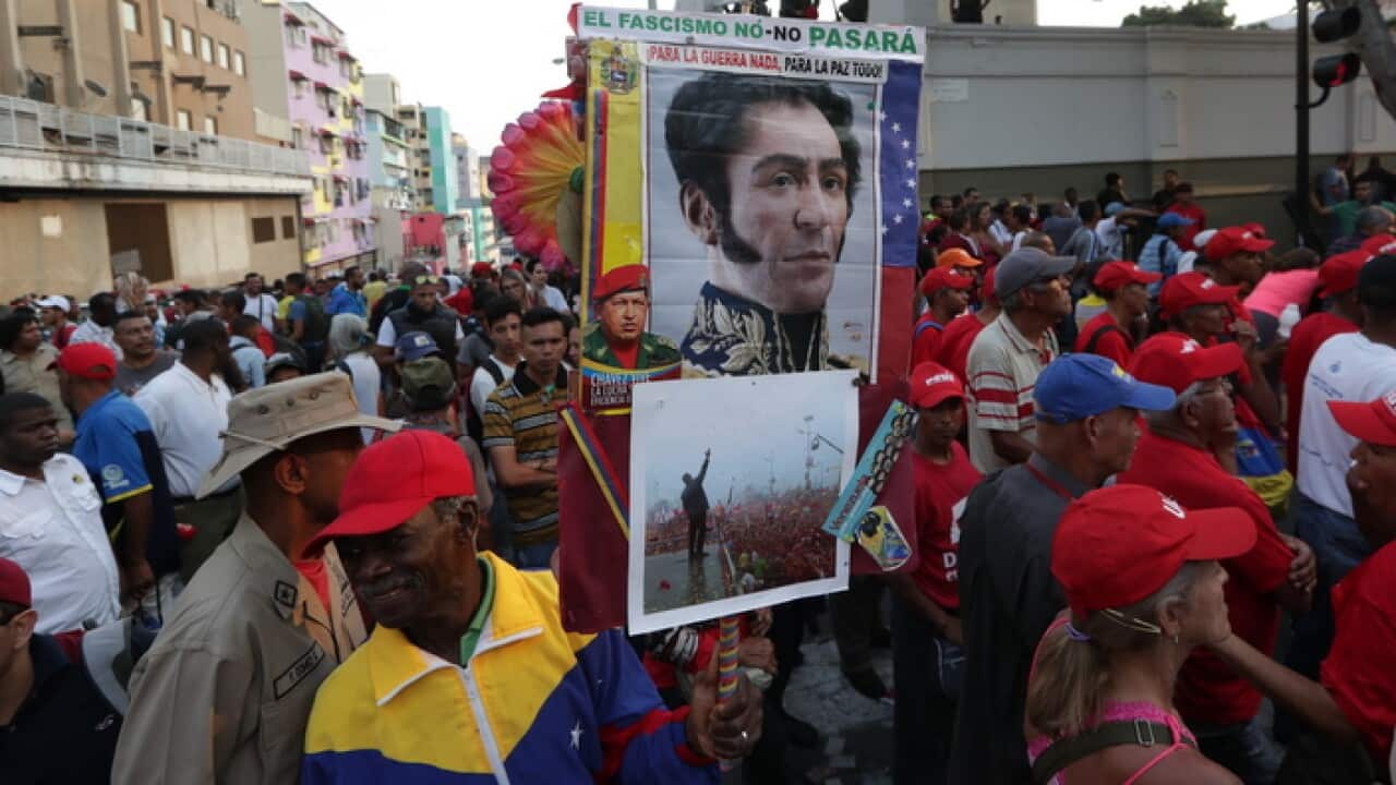 epa07539024 Nicolas Maduro's supporters participate in a protest to support the government, at the Miraflores Palace, in Caracas, Venezuela, 30 April 2019.