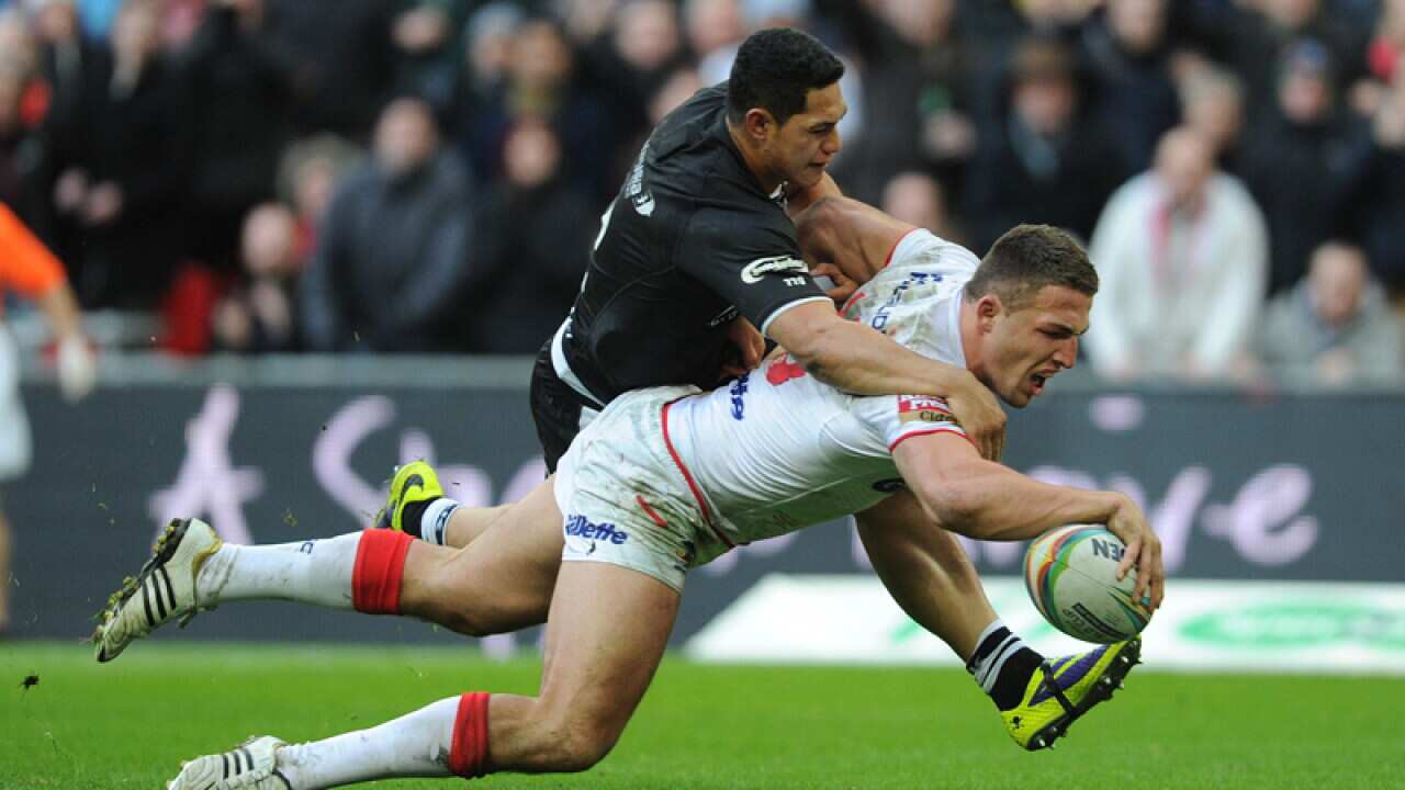 Sam Burgess (R) in action for England