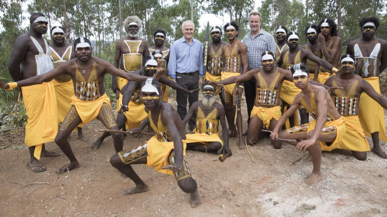 Prime Minister Malcolm Turnbull (left) and Minister for Indigenous Affairs Nigel Scullion with dancers from the Gumatj clan during the Garma Festival
