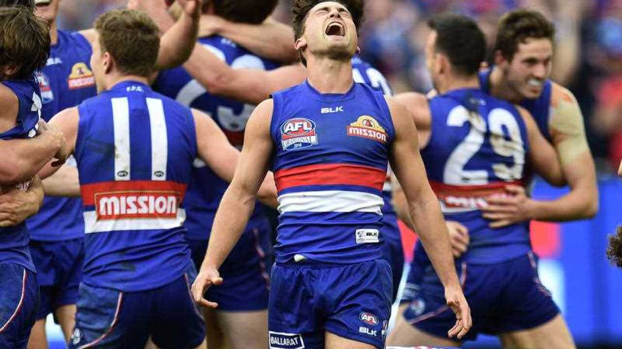 Luke Dahlhaus of the Bulldogs reacts after winning the AFL Grand Final