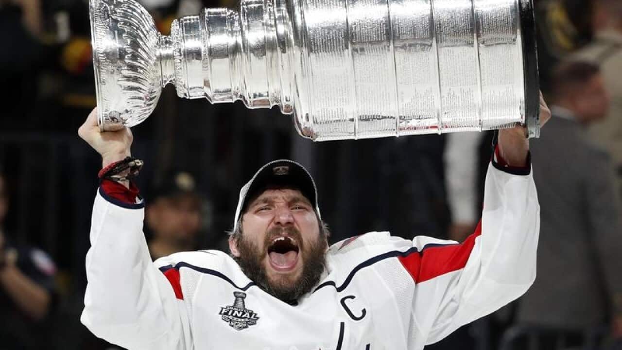 Alex Ovechkin hoists the Stanley Cup