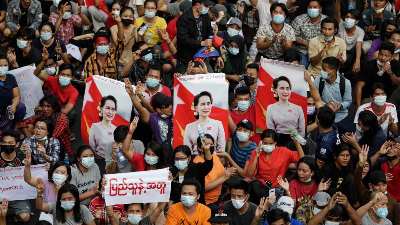 Demonstrators flash the three-finger salute during a protest against the military coup, in Yangon, Myanmar, 6 February 2021.