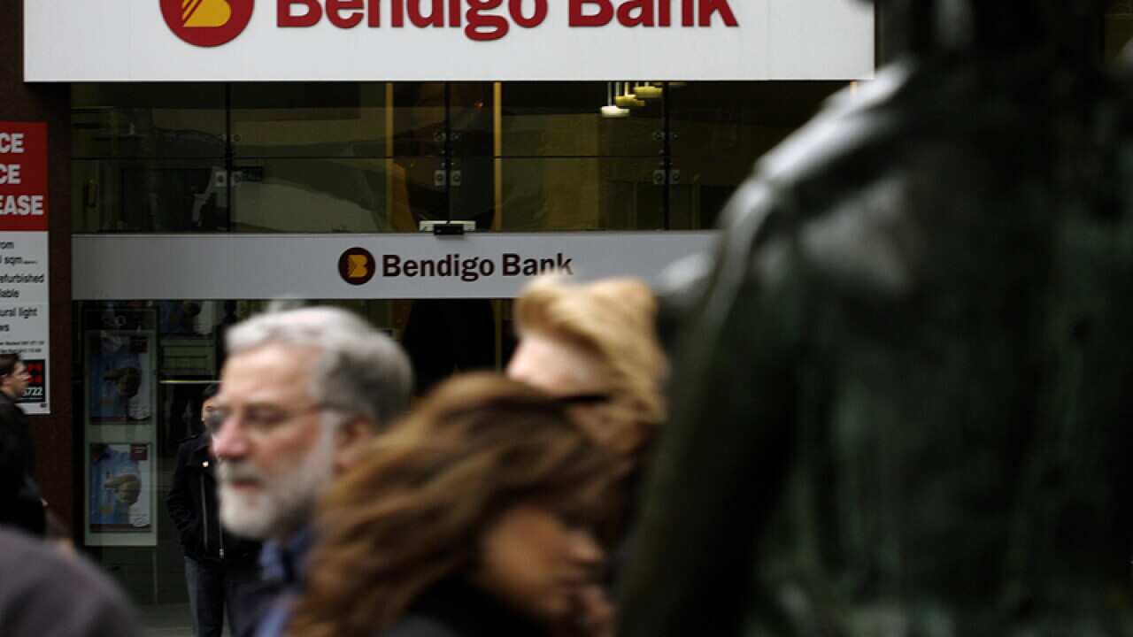People walking past a Bendigo bank branch in Melbourne