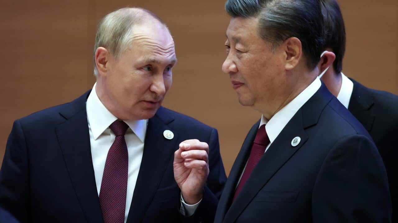 Russian President Vladimir Putin speaks with Chinese President Xi Jinping at the 22nd Shanghai Cooperation Organisation Heads of State Council Summit, in Samarkand, Uzbekistan.