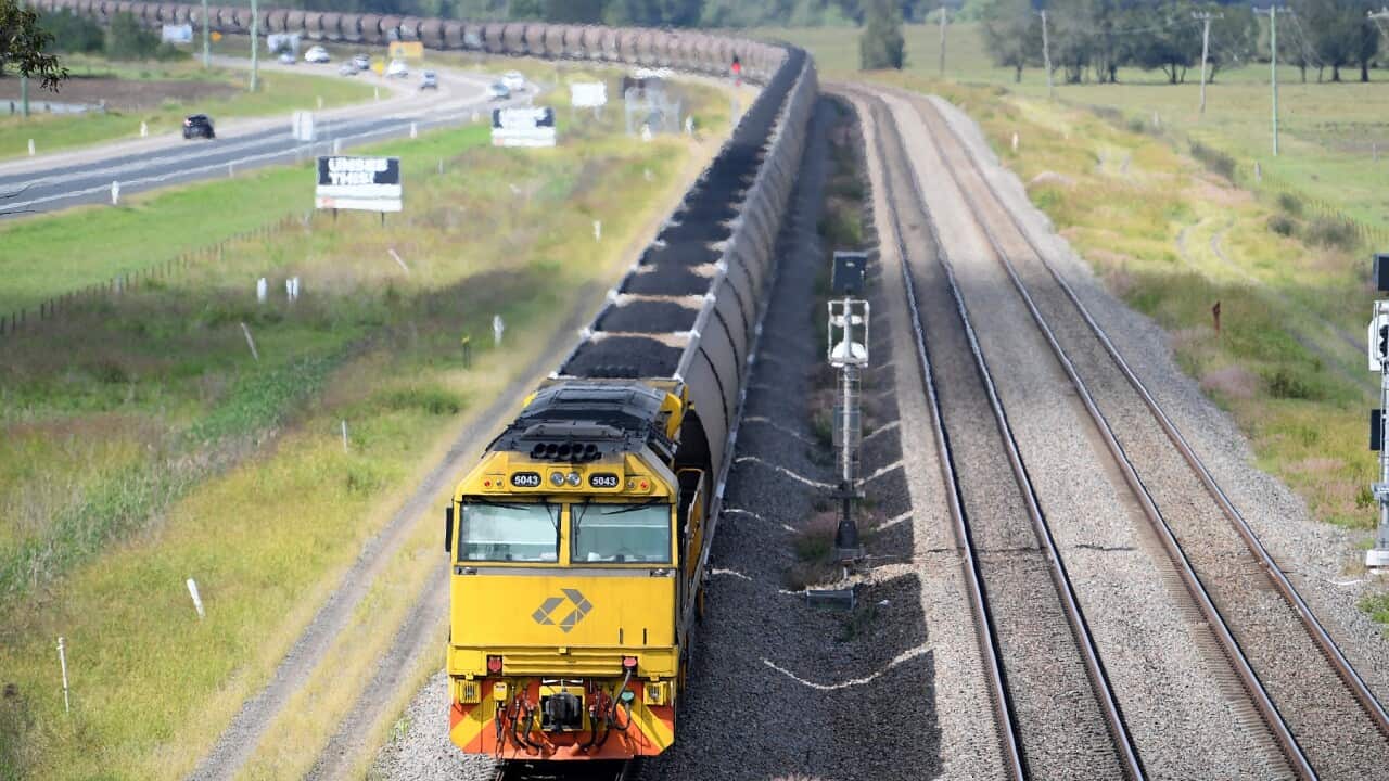 A loaded coal train is seen passing through the outskirts of Singleton, in the NSW Hunter Valley region
