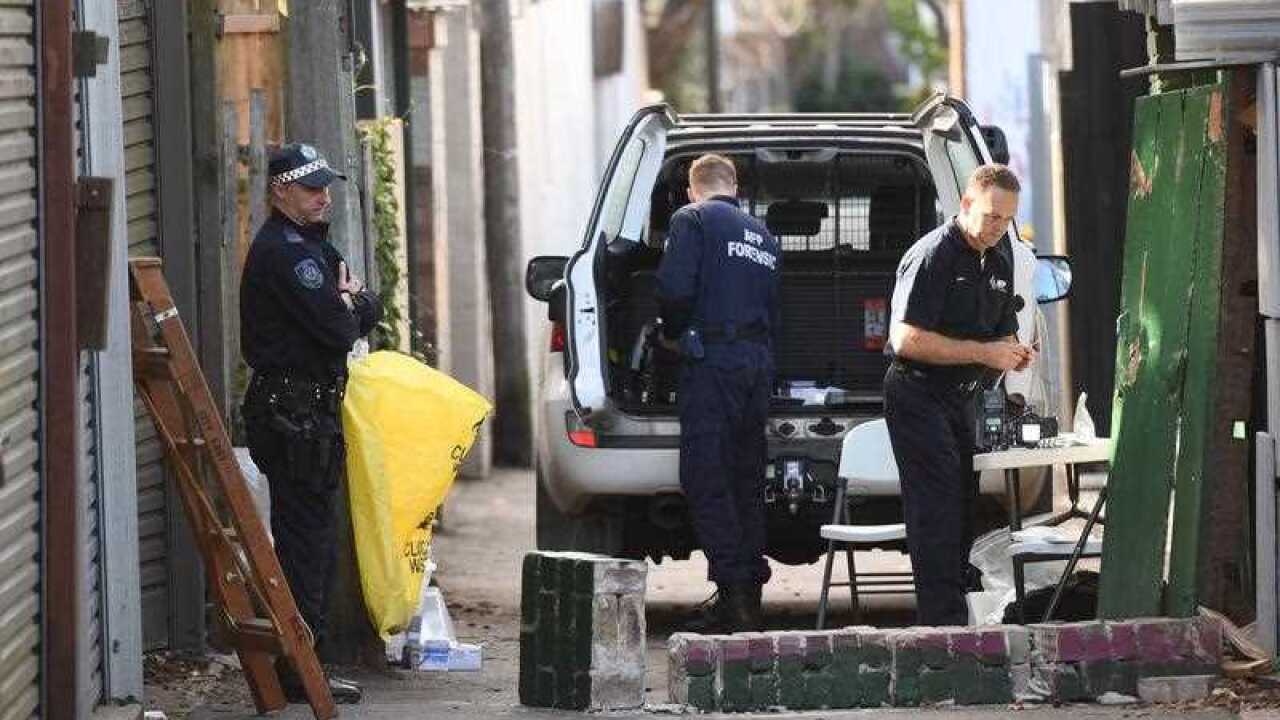 Federal and State Police officers are seen at a crime scene in Surry Hills, Sydney, Australia on Sunday, 30 July, 2017.