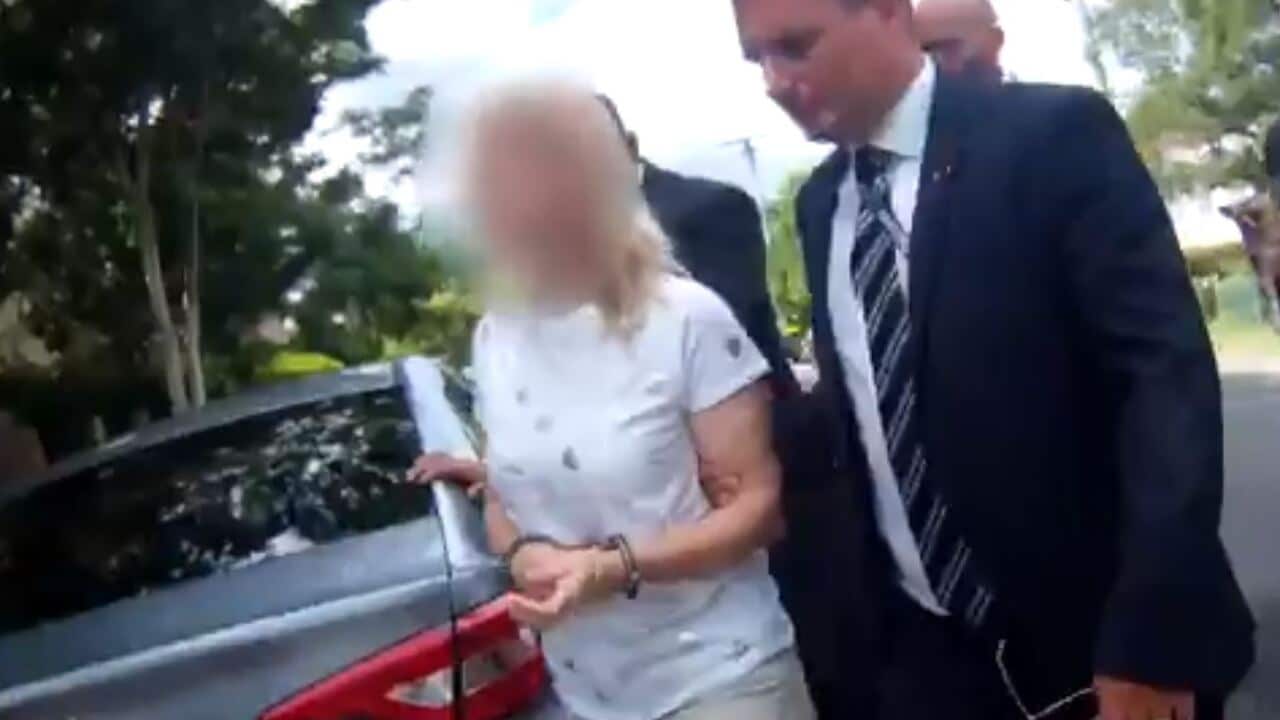 Footage shows the moment police take the mother accused of her children's murders into custody.