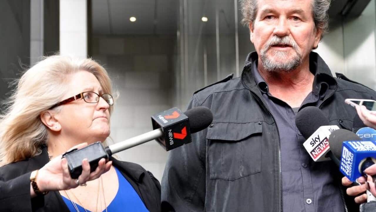 Lead test case plaintiffs Sandra and Garry Elwood speak to media.