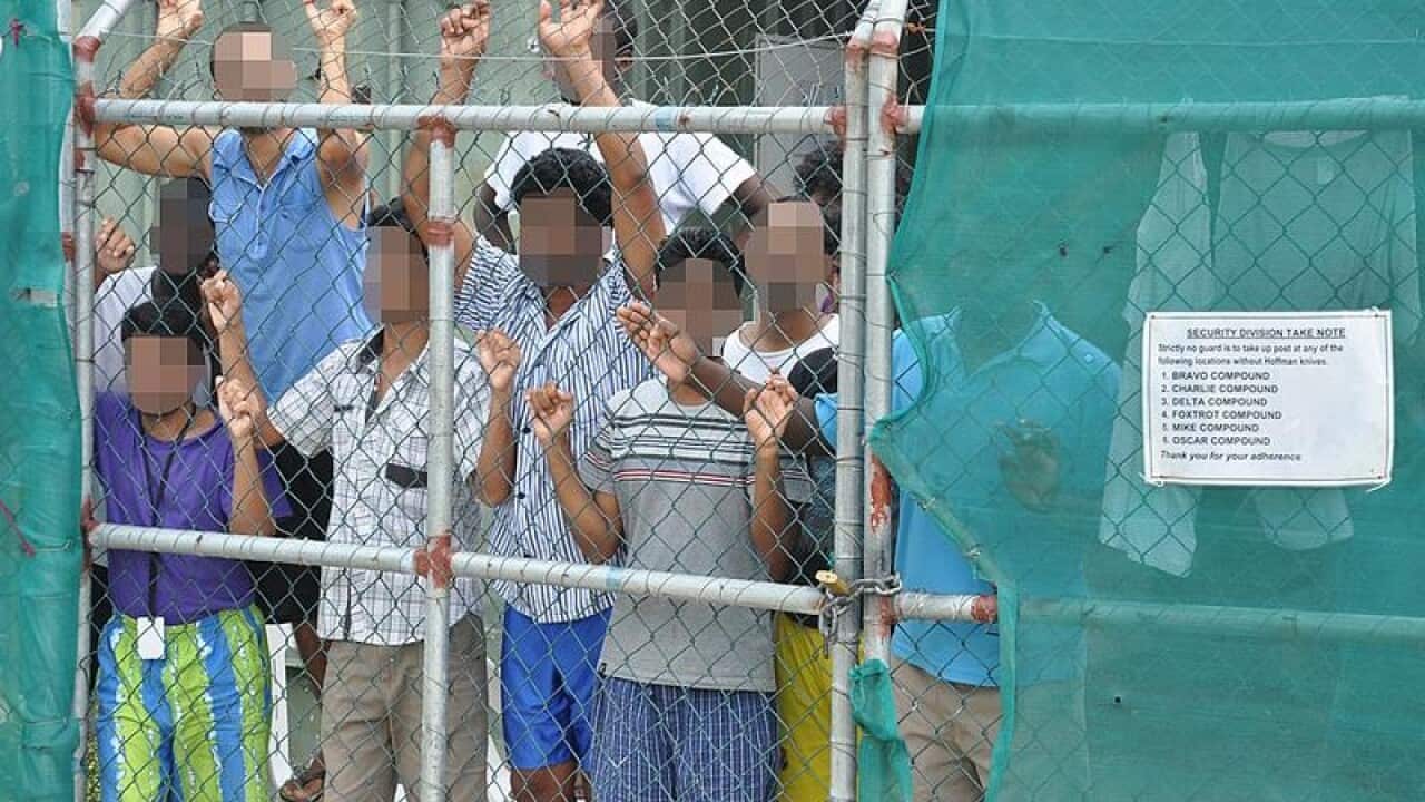 A file photo shows asylum seekers at Manus Island.