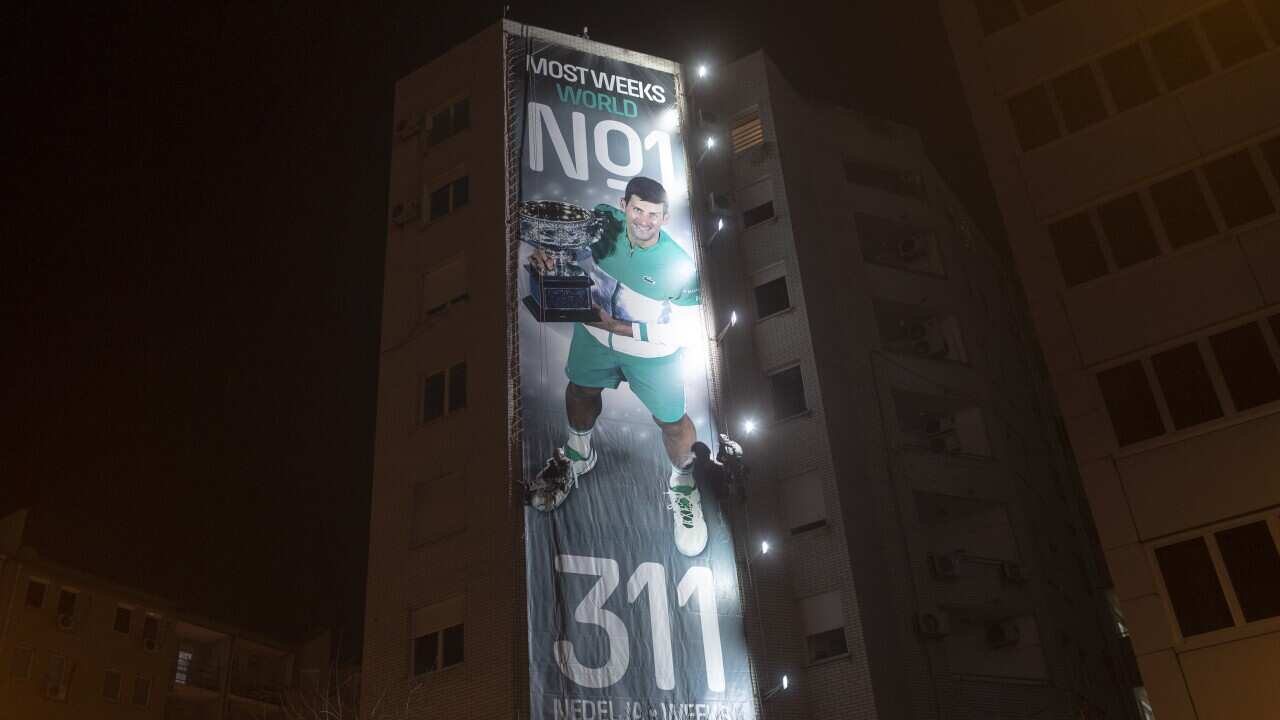 A billboard celebrating Novak Djokovic is displayed in Belgrade, Serbia, Monday, March 8, 2021. Hundreds of Novak Djokovic supporters have staged boisterous street celebrations after the Serb set a new record for most weeks as the mens world No. 1. Djokov