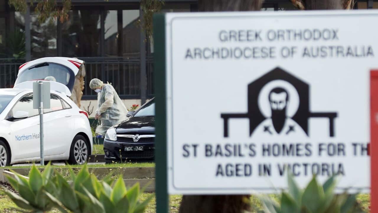 Medical staff are seen preparing to transport people from the St Basil’s Home for the Aged Care in Fawkner which has had an outbreak of COVID-19.