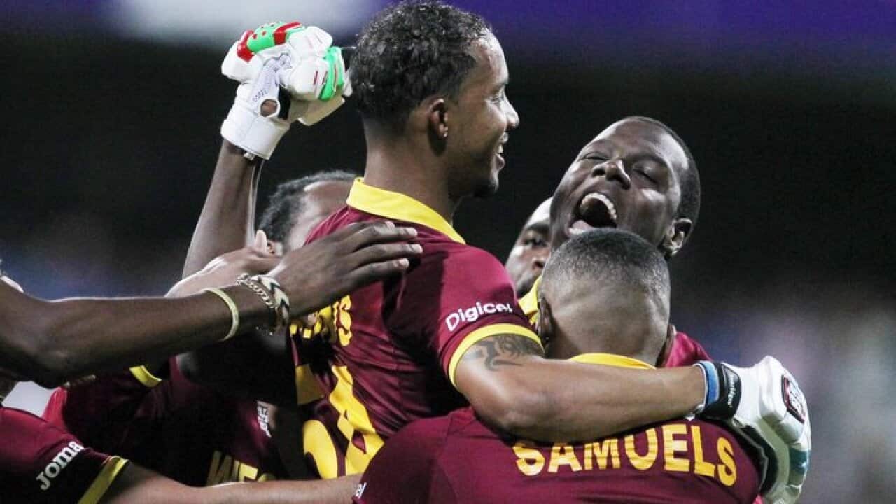 West Indies Lendl Simmons is held aloft by teammates as they celebrate their seven wicket win over India at the ICC World Twenty20 cricket semifinal match