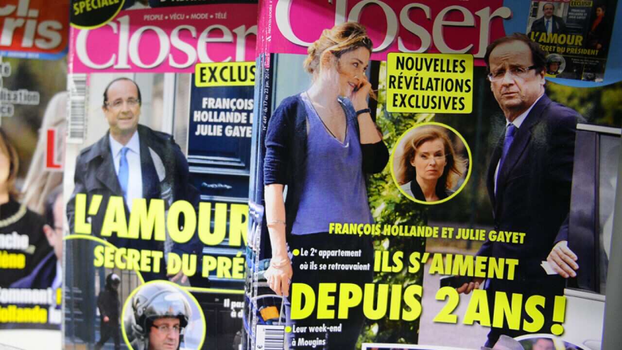 Celebrity news magazines on display at a Paris newstand