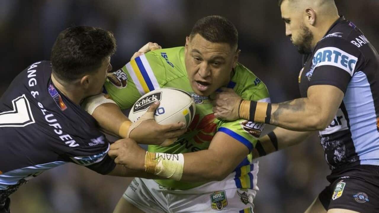 Josh Papalii of the Raiders is tackled during Round 22.