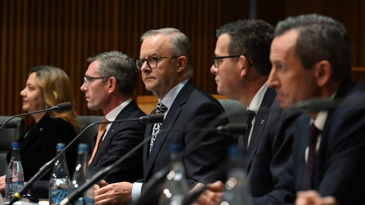 Prime Minister Anthony Albanese and state and territory leaders sit around a table during a national cabinet meeting.