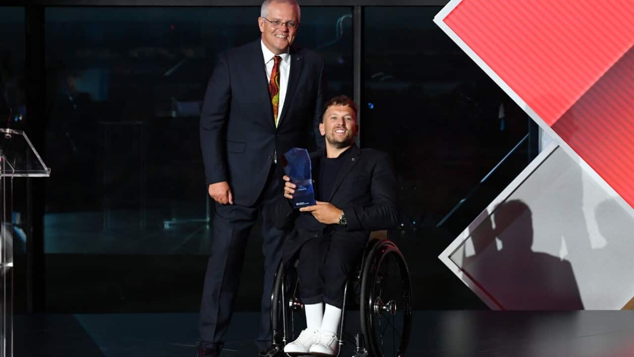Prime Minister Scott Morrison and 2022 Australian of the Year winner Dylan Alcott during the 2022 Australian of the Year Awards ceremony, at the National Arboretum in Canberra, Tuesday, January 25, 2022.