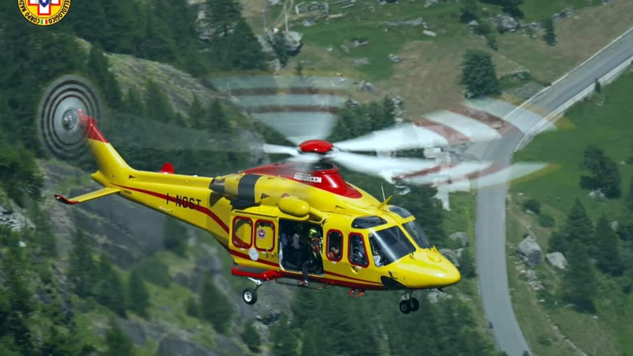 A helicopter of the Italian Alpine Rescue deployed in an evacuation of people stuck in cable cars at Mont Blanc mountain