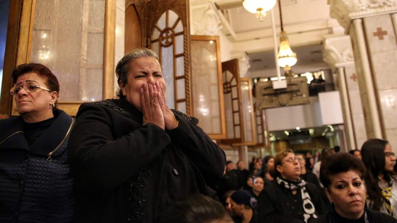 A funeral for the victims of an attack at the Mar Mina Church in the working-class suburb of Helwan, Cairo.