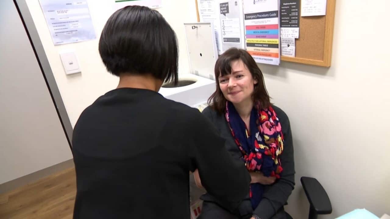 Oksana receives a flu shot