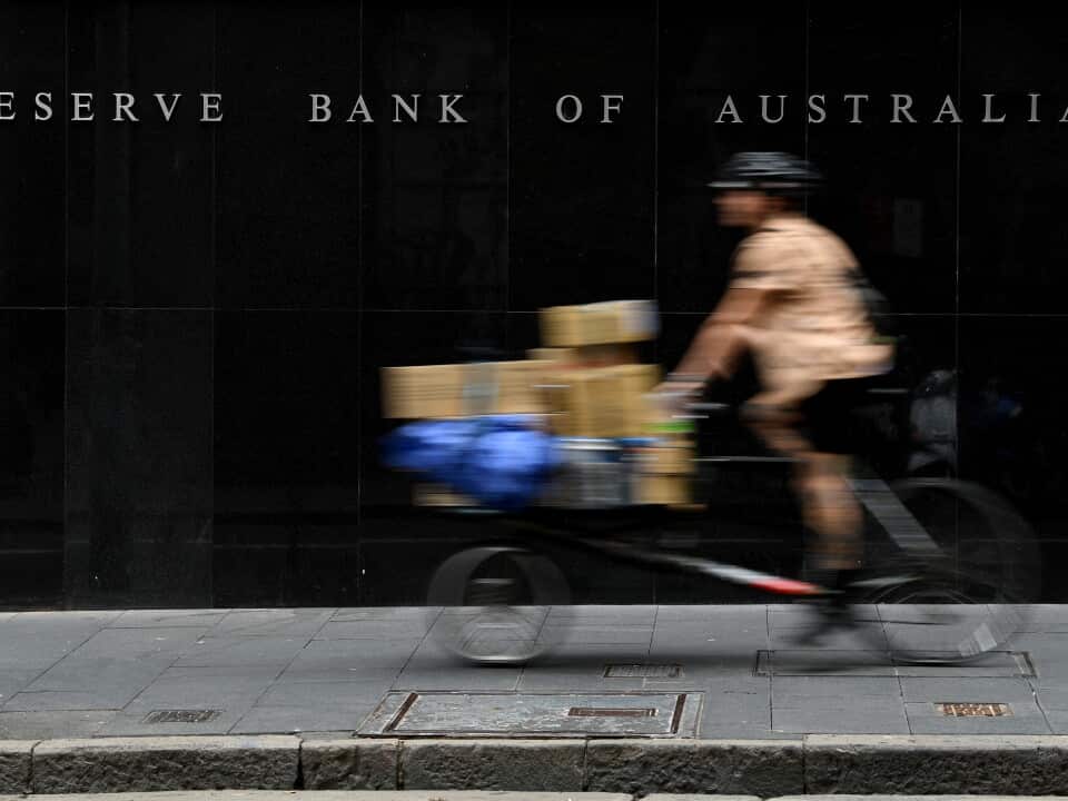 A bike moving past the Reserve Bank of Australia building.