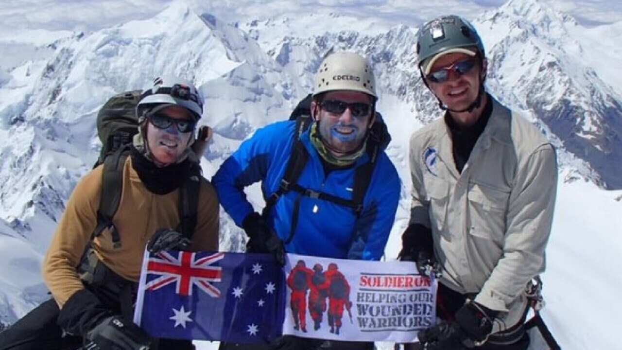 Australian climber Terry Harch (centre) has been rescued from a New Zealand mountain.