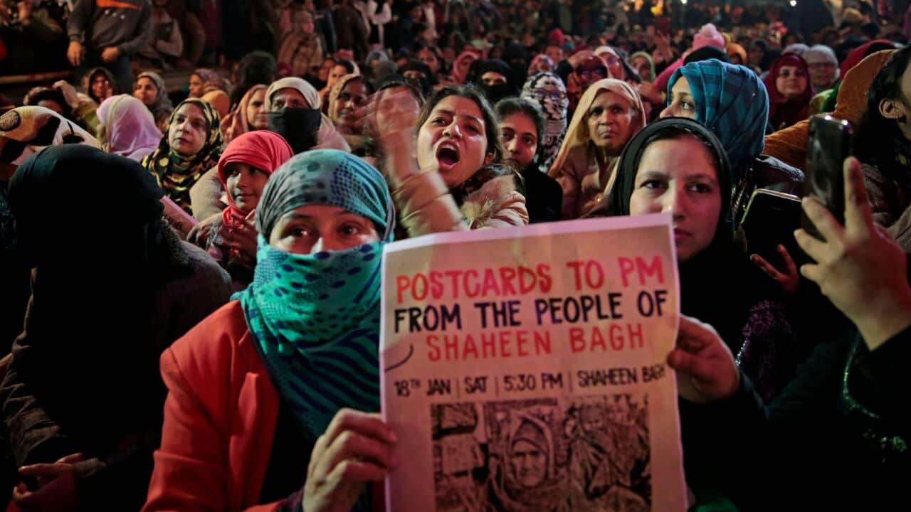 In this Saturday, Jan. 18, 2020 photo, women protesters shout slogans at the protest site at Shaheen Bagh area in New Delhi, India. Muslim women are transcending the confines of their homes to lay claim to the streets of this nondescript Muslim neighborho