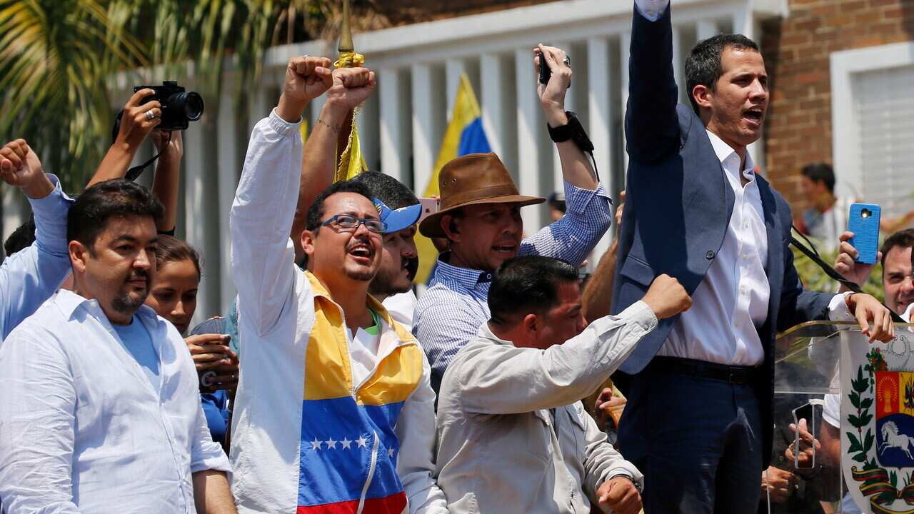Lawyer Roberto Marrero, left, attends a rally with Venezuelan opposition leader Juan Guaido on 16 March, 2019.