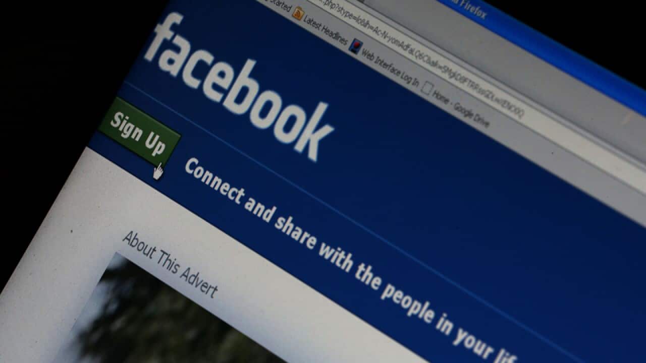 The Facebook home page on a laptop